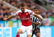 Överraskande nog river han upp kontraktet för den tidigare Arsenal-spelaren Aaron Ramsey efter bara sex matcher